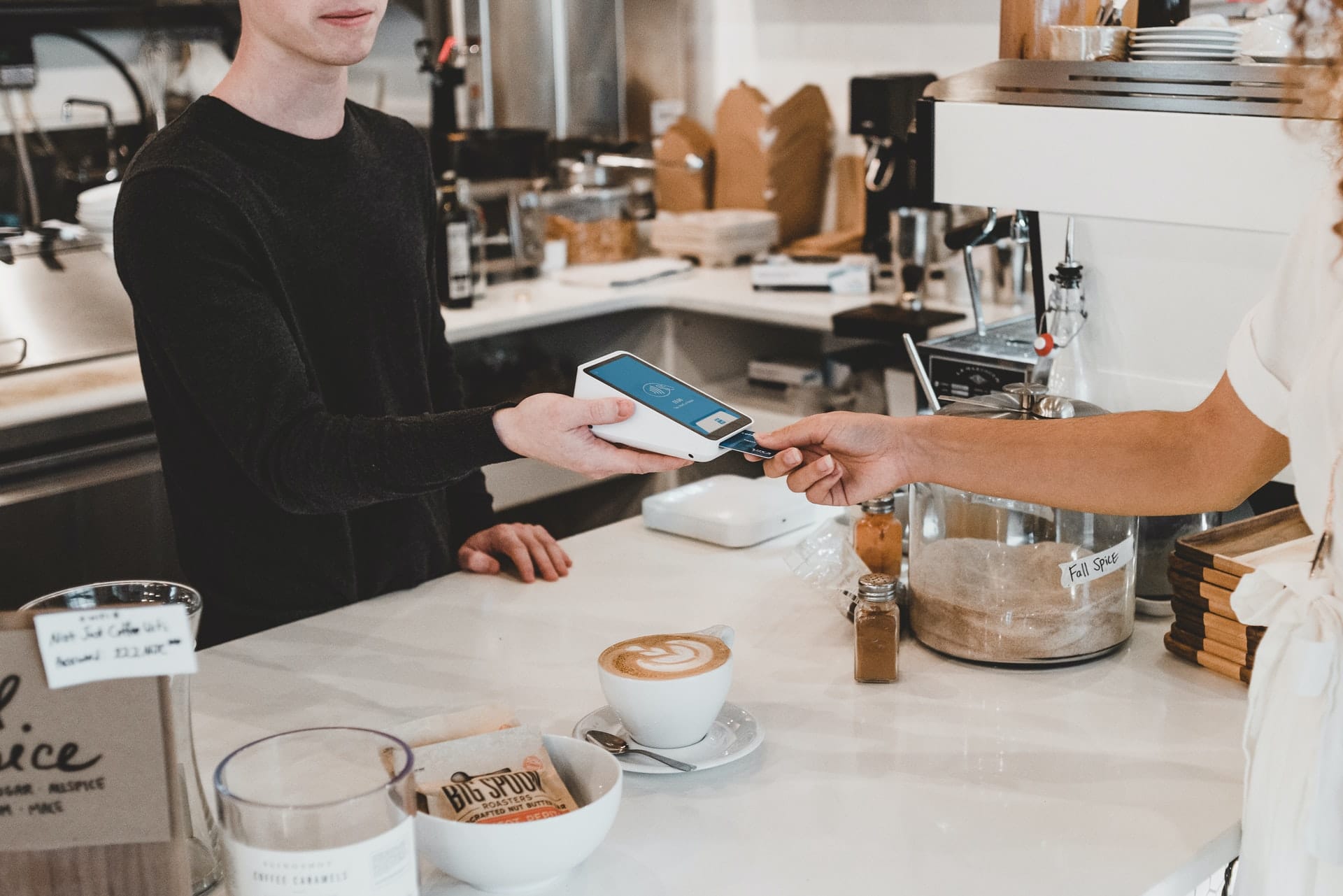 Someone makes a sale at a local retail store – using a credit card.