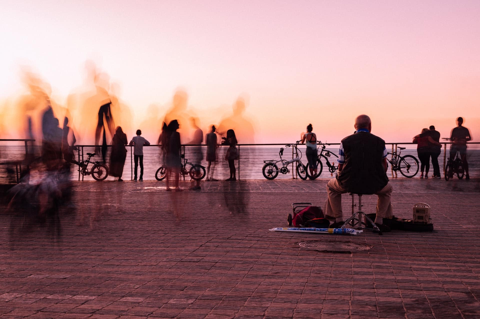 In the photo, people are moving through the city by different means of transport.