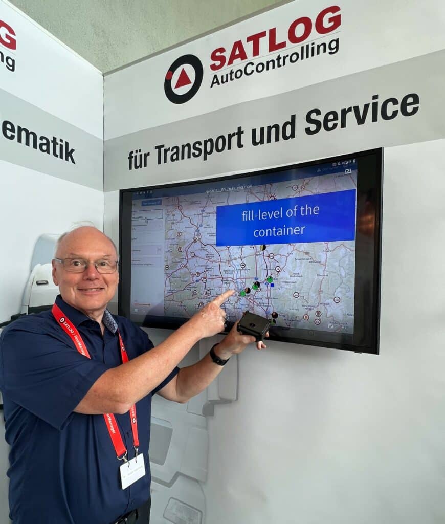 Dr. Jürgen Stausberg, Managing Director at our partner Satlog at his booth at NUFAM, showcasing his solution featuring HERE Location Services